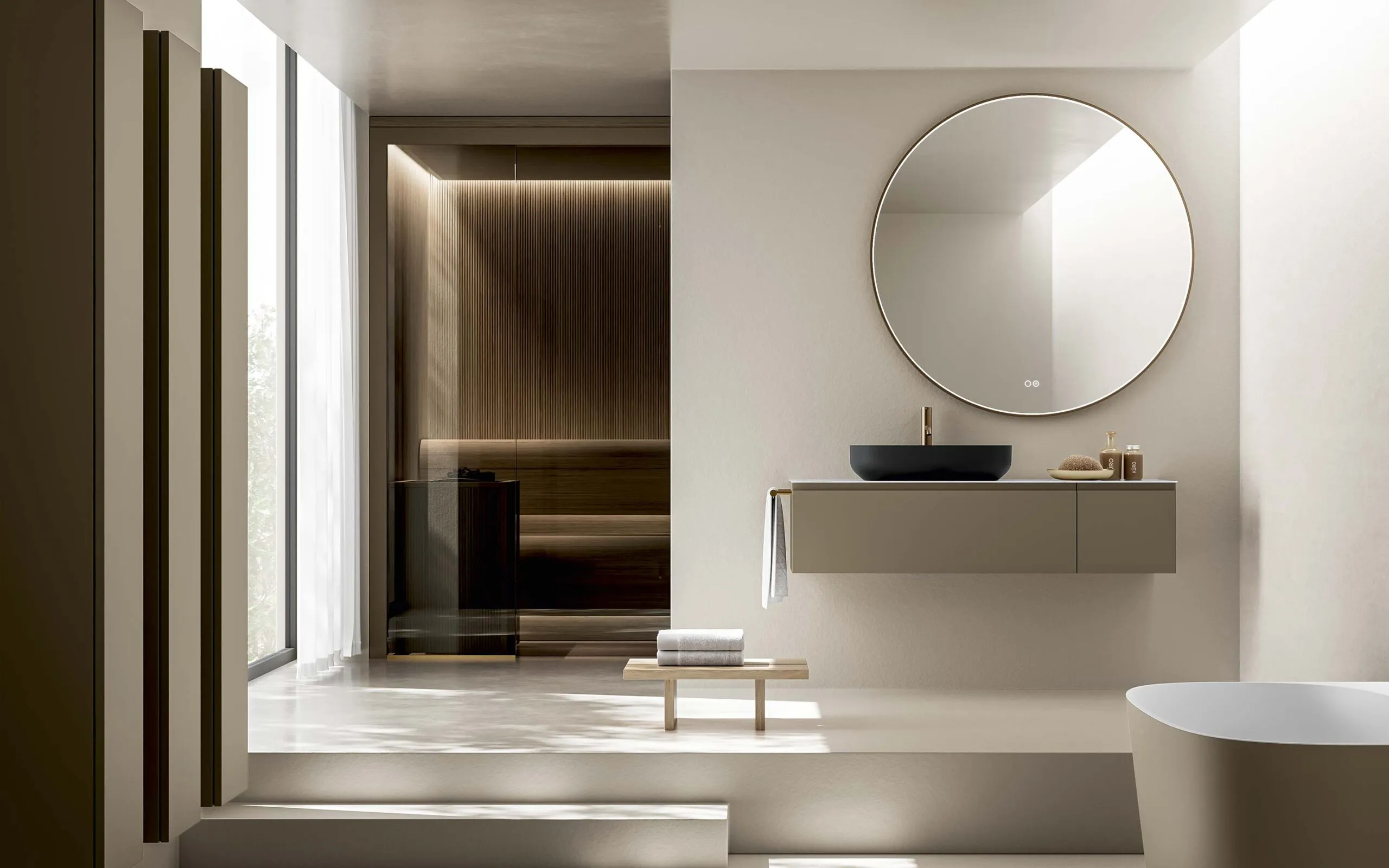 Modernes Badezimmer von Stocco mit schwebendem Waschtisch, rundem Spiegel, Aufsatzbecken und integrierter Sauna im Hintergrund.