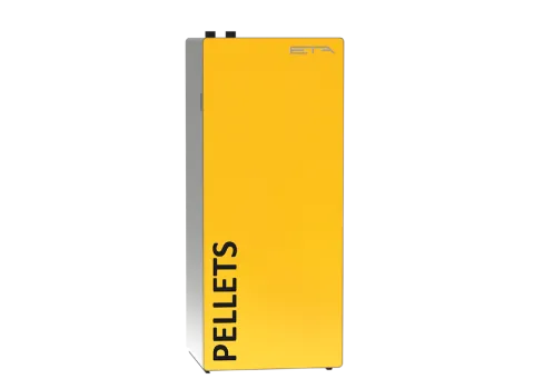 Gelber Holzpelletskessel von ETA vor neutralem Hintergrund.